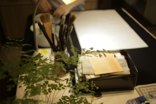 white printer paper on brown wooden table