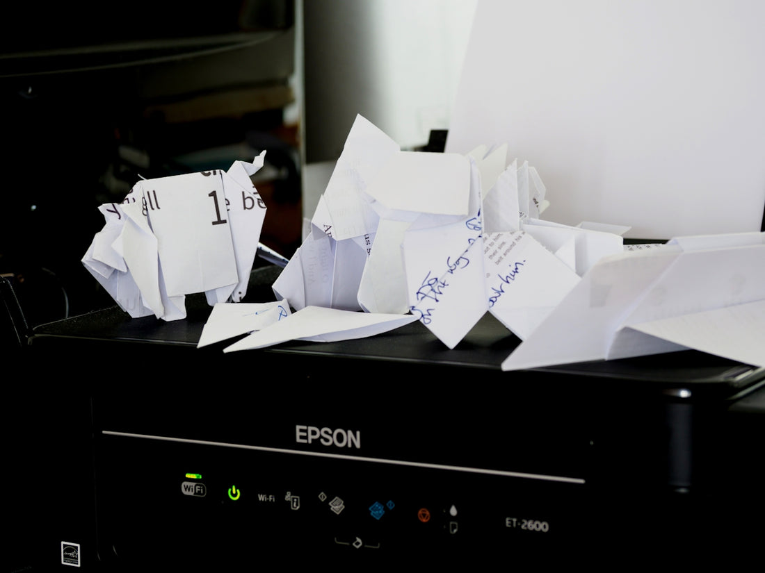a pile of papers sitting on top of a black box