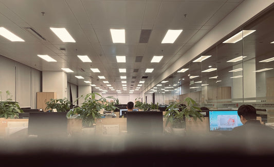 a man sitting at a desk in an office