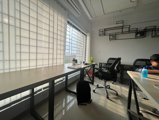 a man sitting at a desk in an office