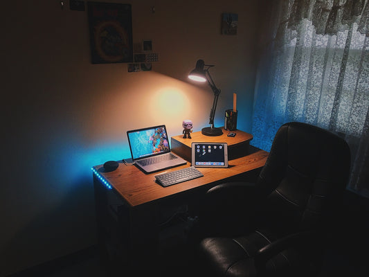 turned-on laptop computer on desk