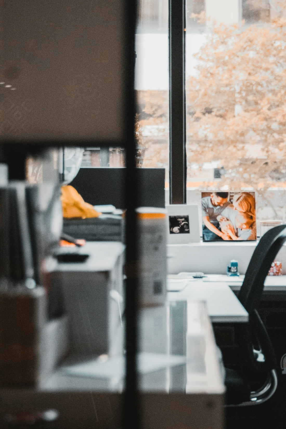 an office with a desk and a window