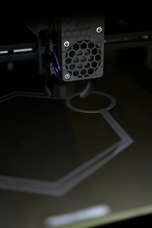 3D printer creating a hexagonal shape