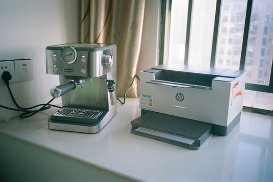 Espresso machine and hp printer on windowsill